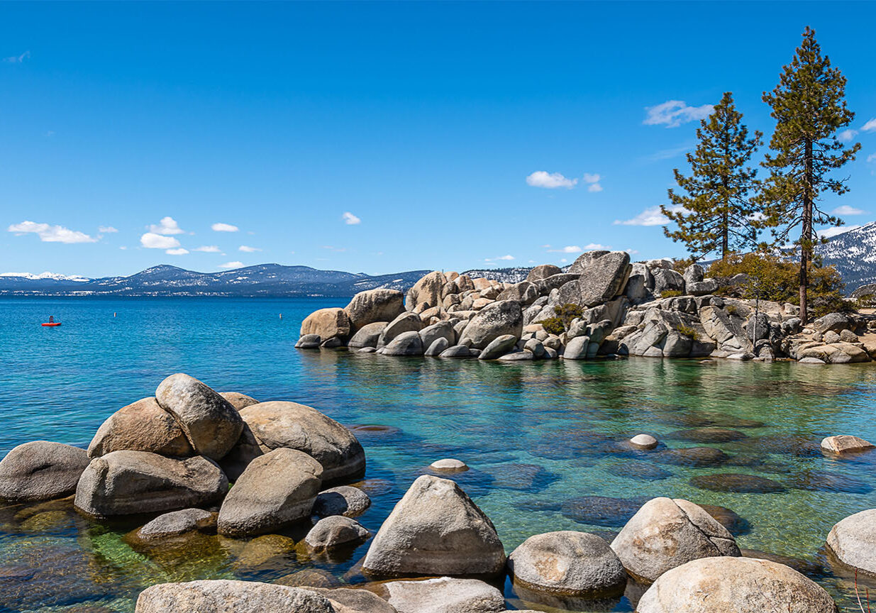 Nature coastal scene with water and rocks.
